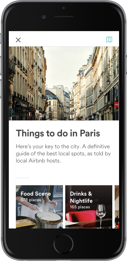 Ecran de smartphone avec l'application Airbnb et le guide local